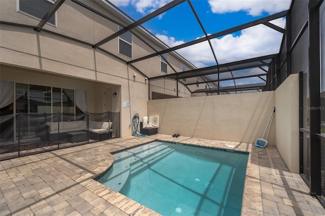 1660 Tropical Palms Cir, Kissimmee, FL 34747 - view of swimming pool with a patio, glass enclosure, and an outdoor living space