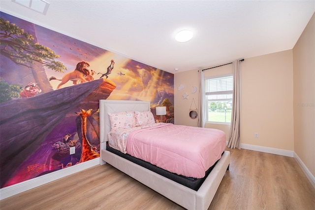 1660 Tropical Palms Cir, Kissimmee, FL 34747 - bedroom featuring wood finished floors and baseboards
