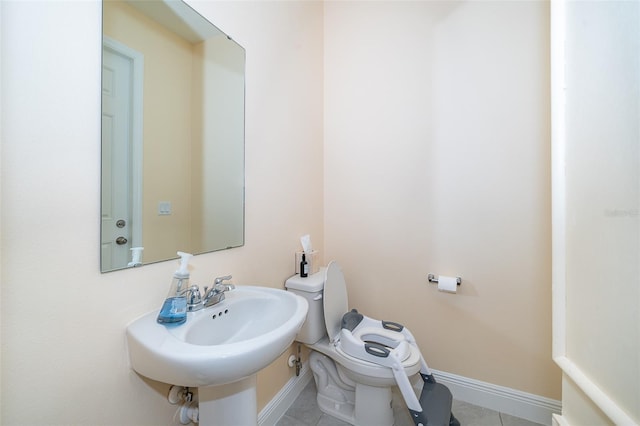 1660 Tropical Palms Cir, Kissimmee, FL 34747 - half bathroom with toilet and tile patterned flooring