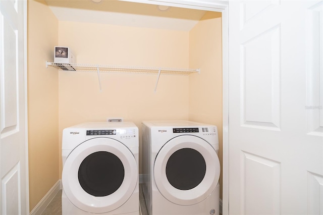 1660 Tropical Palms Cir, Kissimmee, FL 34747 - washroom featuring separate washer and dryer and baseboards