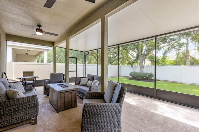 8827 Arrabida Ln, Orlando, FL 32836 - sunroom with ceiling fan and an outdoor living space with a fire pit
