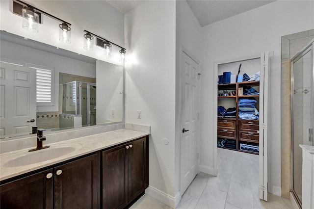 8827 Arrabida Ln, Orlando, FL 32836 - bathroom with a stall shower, vanity, and a walk in closet