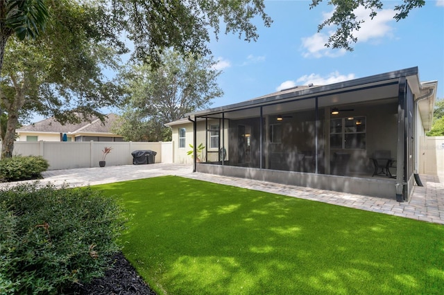 8827 Arrabida Ln, Orlando, FL 32836 - back of property with a sunroom and a patio