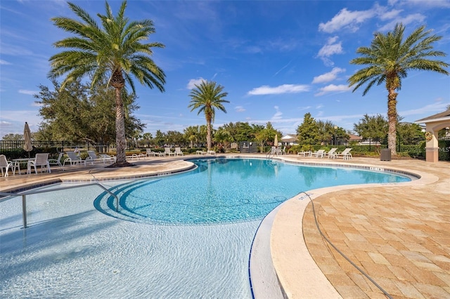 8827 Arrabida Ln, Orlando, FL 32836 - community pool featuring a patio area