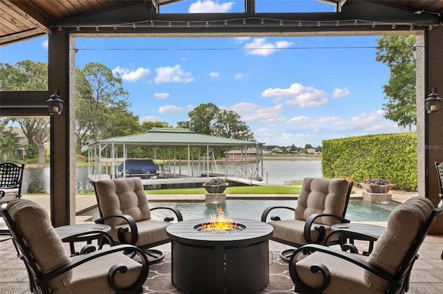 9070 Ron Den Ln, Windermere, FL 34786 - view of patio / terrace with a fire pit, a water view, boat lift, and a dock