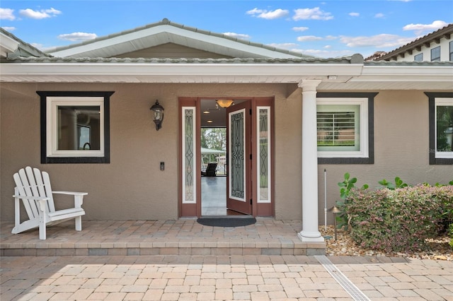 9070 Ron Den Ln, Windermere, FL 34786 - property entrance with stucco siding and covered porch