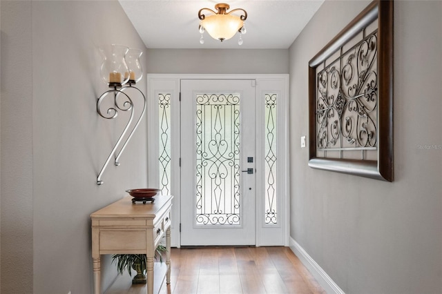 9070 Ron Den Ln, Windermere, FL 34786 - foyer with healthy amount of natural light and wood finished floors