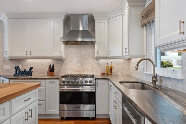 9070 Ron Den Ln, Windermere, FL 34786 - kitchen with stainless steel appliances, wall chimney exhaust hood, decorative backsplash, and white cabinetry