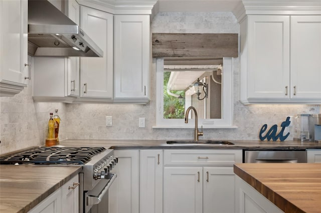 9070 Ron Den Ln, Windermere, FL 34786 - kitchen with exhaust hood, appliances with stainless steel finishes, wood counters, backsplash, and white cabinetry