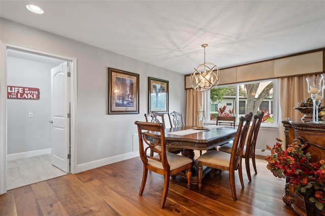 9070 Ron Den Ln, Windermere, FL 34786 - dining space with a chandelier, wood finished floors, and recessed lighting