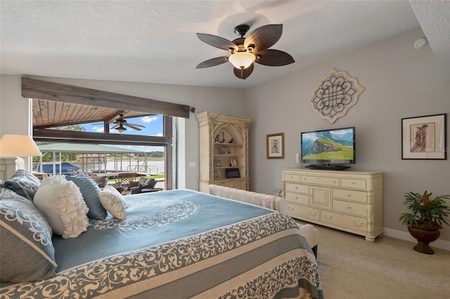 9070 Ron Den Ln, Windermere, FL 34786 - bedroom featuring vaulted ceiling, light colored carpet, access to outside, a ceiling fan, and a textured ceiling