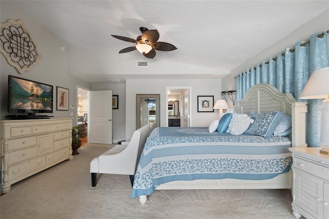 9070 Ron Den Ln, Windermere, FL 34786 - bedroom with vaulted ceiling, light carpet, ceiling fan, and ensuite bathroom