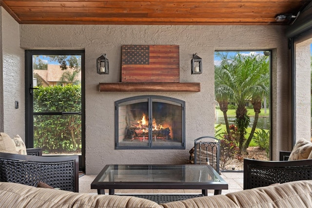 9070 Ron Den Ln, Windermere, FL 34786 - living room featuring a textured wall, wood ceiling, and a warm lit fireplace