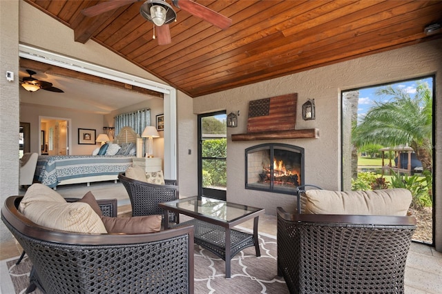 9070 Ron Den Ln, Windermere, FL 34786 - view of patio / terrace with an outdoor living space with a fireplace and a ceiling fan