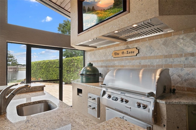 9070 Ron Den Ln, Windermere, FL 34786 - view of patio with a sink and exterior kitchen