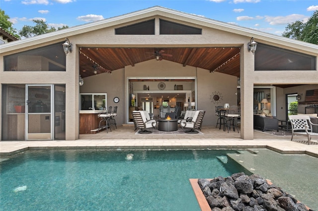 9070 Ron Den Ln, Windermere, FL 34786 - back of property featuring ceiling fan, a patio area, and an outdoor pool