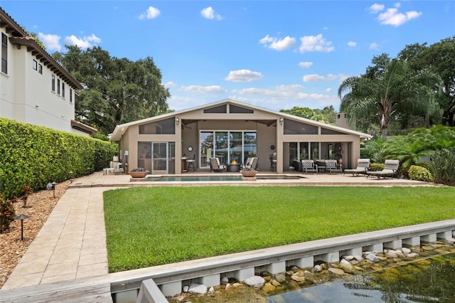 9070 Ron Den Ln, Windermere, FL 34786 - rear view of house with a patio, outdoor lounge area, a lawn, and an outdoor pool
