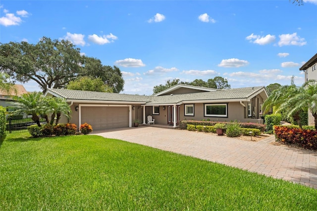 9070 Ron Den Ln, Windermere, FL 34786 - single story home featuring an attached garage, driveway, stucco siding, and a tile roof