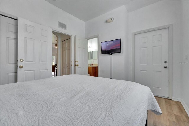 216 Bergamo Dr, Davenport, FL 33897 - bedroom featuring light wood-type flooring and ensuite bath