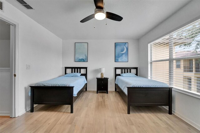 216 Bergamo Dr, Davenport, FL 33897 - bedroom with light wood-style flooring and ceiling fan