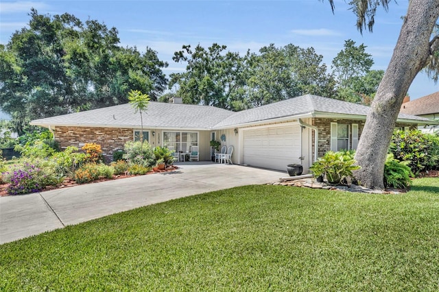 1238 Palmetto Rd, Eustis, FL 32726 - ranch-style home with a garage, a front yard, driveway, brick siding, and a shingled roof