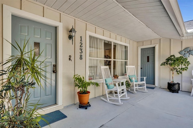 1238 Palmetto Rd, Eustis, FL 32726 - property entrance featuring a porch and board and batten siding