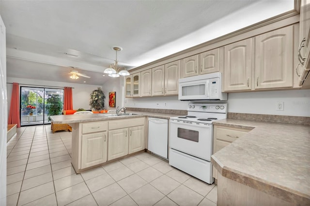 1238 Palmetto Rd, Eustis, FL 32726 - kitchen featuring white appliances, a peninsula, light countertops, and light tile patterned floors