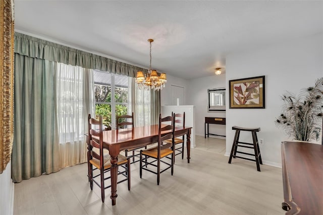 1238 Palmetto Rd, Eustis, FL 32726 - dining room with a chandelier and light wood finished floors