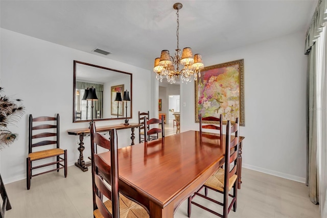 1238 Palmetto Rd, Eustis, FL 32726 - dining room featuring a chandelier and light flooring
