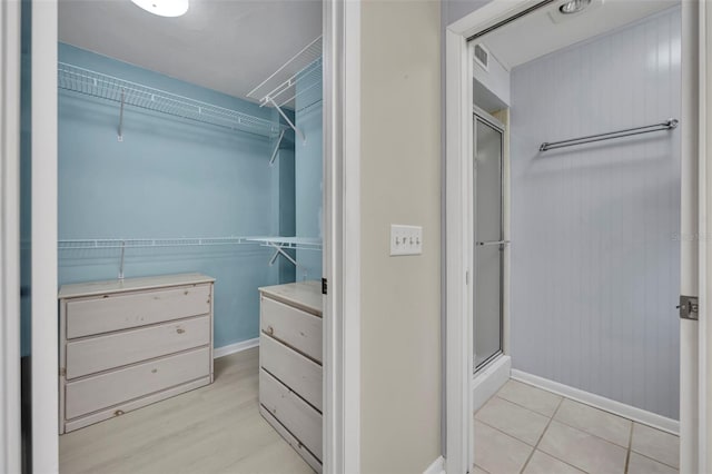 1238 Palmetto Rd, Eustis, FL 32726 - walk in closet with light wood-style flooring