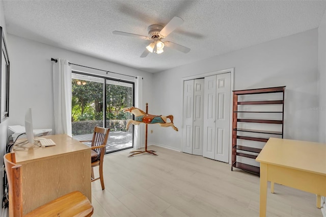 1238 Palmetto Rd, Eustis, FL 32726 - office space with a textured ceiling, ceiling fan, and light wood-type flooring