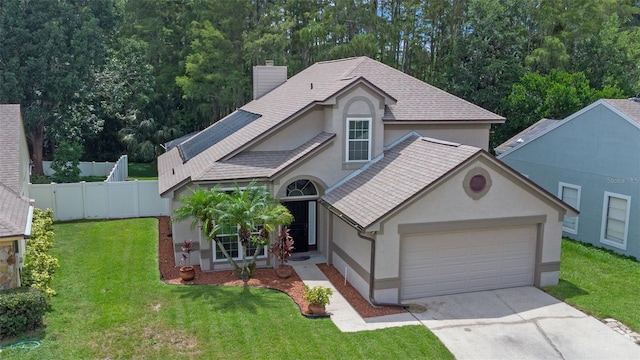1041 Mccully Ct, Oviedo, FL 32765 - view of front of property featuring stucco siding, a chimney, driveway, and an attached garage