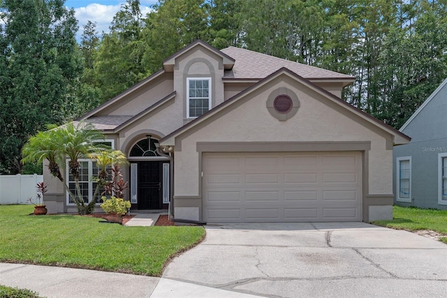1041 Mccully Ct, Oviedo, FL 32765 - view of front of home with stucco siding, driveway, a garage, and a front yard