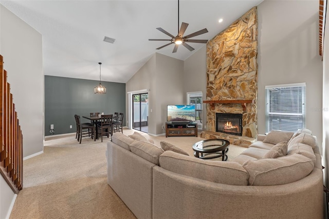 1041 Mccully Ct, Oviedo, FL 32765 - living room with high vaulted ceiling, light colored carpet, a ceiling fan, and a stone fireplace