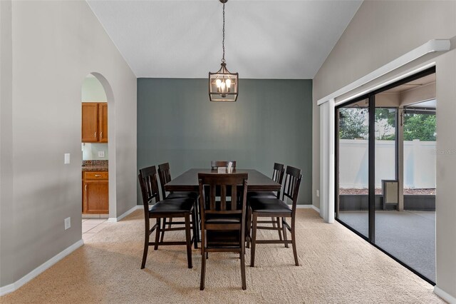 1041 Mccully Ct, Oviedo, FL 32765 - dining room with light colored carpet, a chandelier, and arched walkways