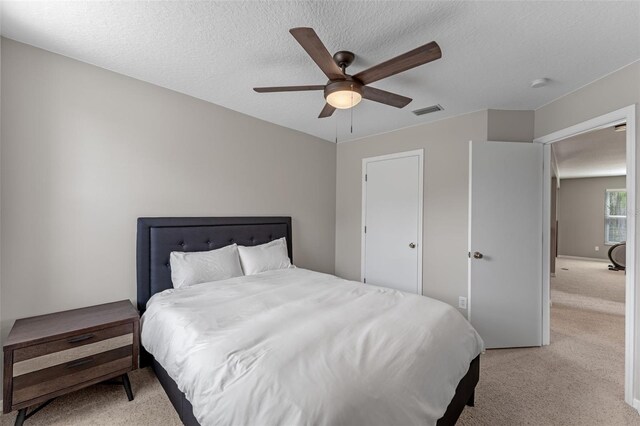 1041 Mccully Ct, Oviedo, FL 32765 - bedroom featuring light colored carpet, a ceiling fan, and a textured ceiling