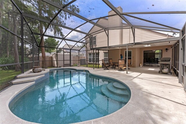 1041 Mccully Ct, Oviedo, FL 32765 - view of swimming pool with a patio, a fenced backyard, grilling area, glass enclosure, and a storage unit