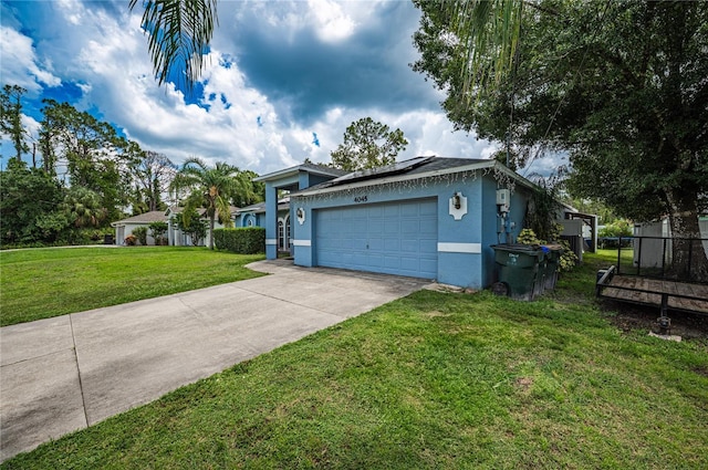 4045 Simkins Ave, North Port, FL 34286 - ranch-style home with stucco siding, an attached garage, roof mounted solar panels, and concrete driveway