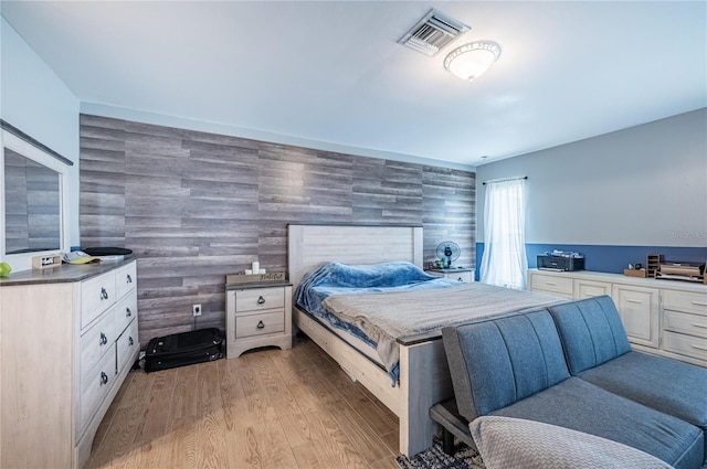4045 Simkins Ave, North Port, FL 34286 - bedroom with wood finished floors and an accent wall