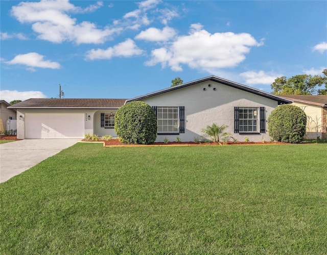 5904 Altec Rd, Orlando, FL 32808 - ranch-style house featuring stucco siding, concrete driveway, a garage, and a front yard
