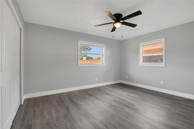 5904 Altec Rd, Orlando, FL 32808 - unfurnished bedroom with a closet, dark wood-style floors, and a ceiling fan