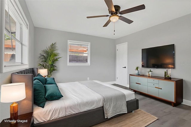 5904 Altec Rd, Orlando, FL 32808 - bedroom with wood finished floors and a ceiling fan
