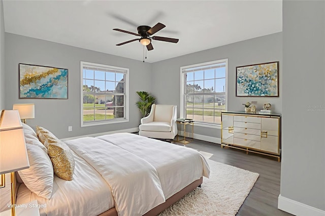 5904 Altec Rd, Orlando, FL 32808 - bedroom featuring multiple windows, dark wood finished floors, and ceiling fan