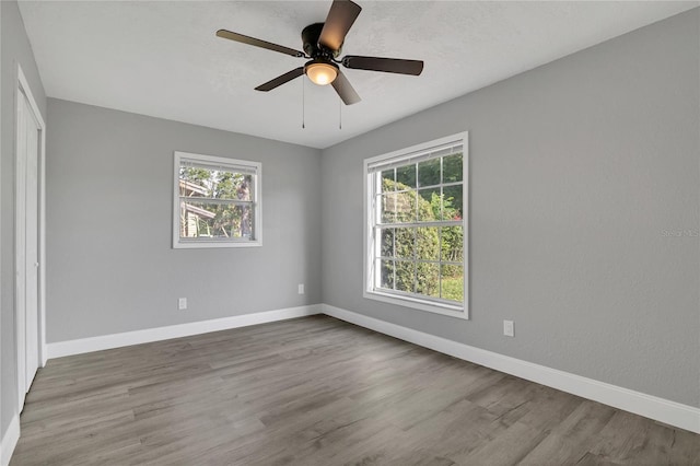 5904 Altec Rd, Orlando, FL 32808 - spare room with healthy amount of natural light, wood finished floors, and a ceiling fan