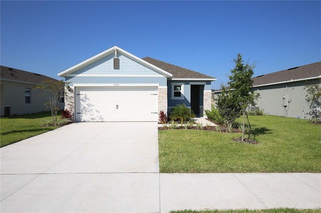 3367 Wynwood Forest Dr, Ocoee, FL 34761 - ranch-style home featuring a front lawn, a garage, concrete driveway, and stone siding