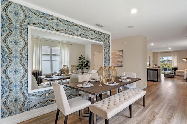 3367 Wynwood Forest Dr, Ocoee, FL 34761 - dining room with wood finished floors and recessed lighting