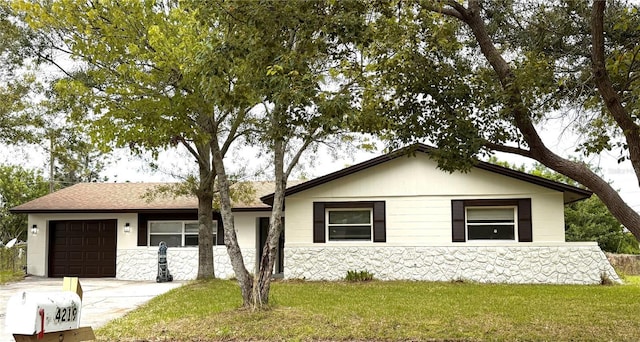 4219 Chateau Rd, Orlando, FL 32808 - single story home with an attached garage, driveway, a front lawn, stone siding, and roof with shingles
