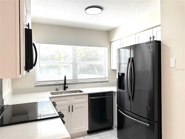 4219 Chateau Rd, Orlando, FL 32808 - kitchen with refrigerator with ice dispenser, dishwasher, a textured ceiling, white cabinets, and light tile patterned flooring