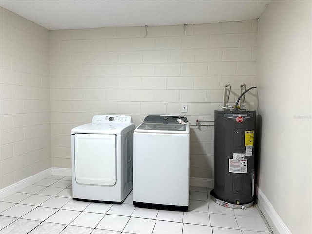 4219 Chateau Rd, Orlando, FL 32808 - washroom featuring electric water heater, independent washer and dryer, and light tile patterned floors