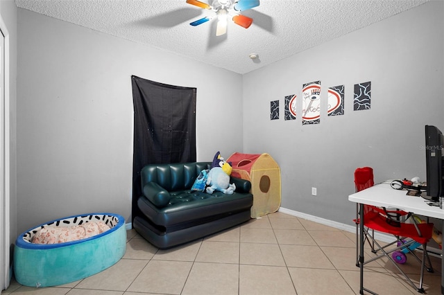 1040 Cannock Dr, Kissimmee, FL 34758 - rec room featuring a textured ceiling, ceiling fan, and tile patterned floors